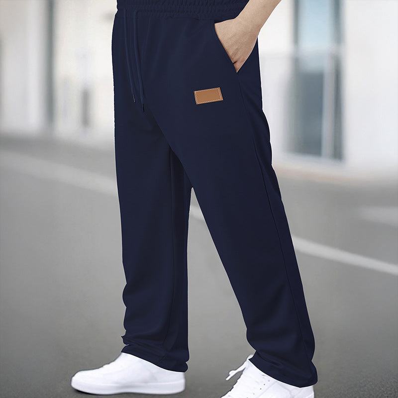 Men's Sporty Jogging Pants with Elastic Waistband and Practical Pockets Skorter