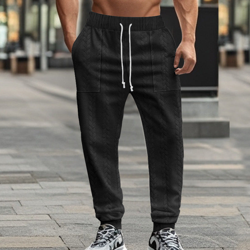 Men's sporty joggers with textured design and elastic waistband Skorter