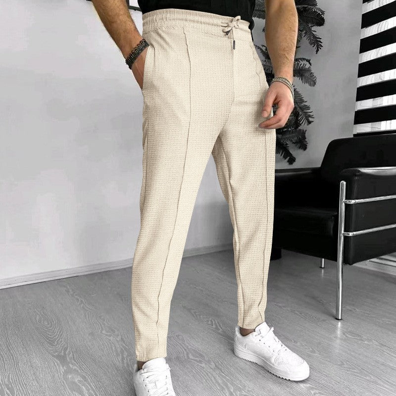 Men's stylish high-waisted pants with elastic drawstring and textured design Skorter