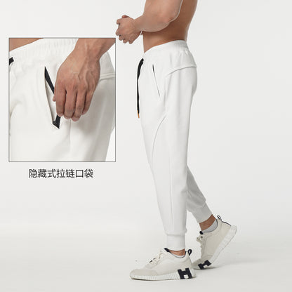 Men's sporty sweatpants with elastic waistband and side zip pockets Skorter