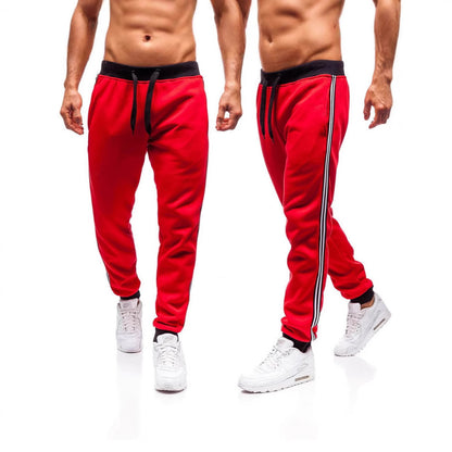 Men's sporty jogging pants with side contrast stripes Skorter