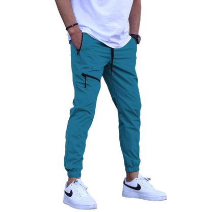 Men's sporty suit pants with elastic waistband and side zip pockets Skorter