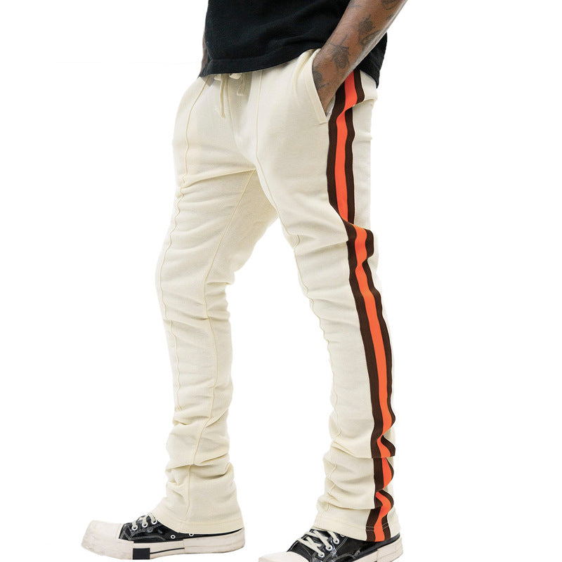 Men's sporty sweatpants with side stripes and adjustable waistband Skorter