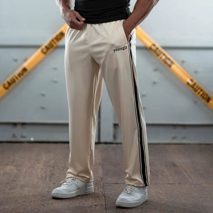 Men's sporty jogging pants with side contrast stripes and elastic waistband Skorter