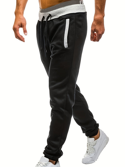 Men's sporty sweatpants with elastic waistband and side pockets Skorter