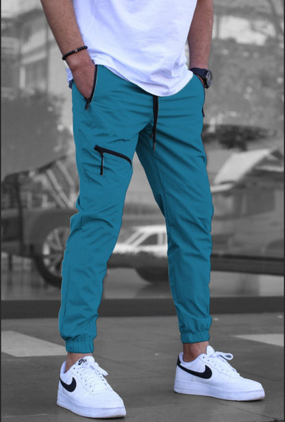 Men's sporty suit pants with elastic waistband and side zip pockets Skorter