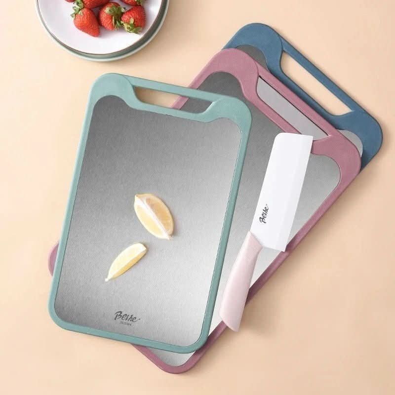 Skorter | Double-sided stainless steel cutting board with non-stick surface and juice groove