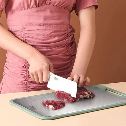 Skorter | Double-sided stainless steel cutting board with non-stick surface and juice groove