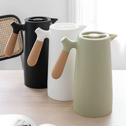 Skorter | Elegant double-walled glass carafe with wooden handle for hot and cold drinks