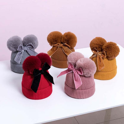 Skorter | Baby hat with double ball bow