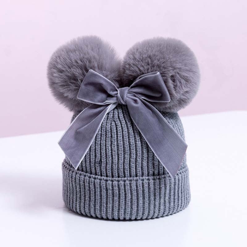 Skorter | Baby hat with double ball bow
