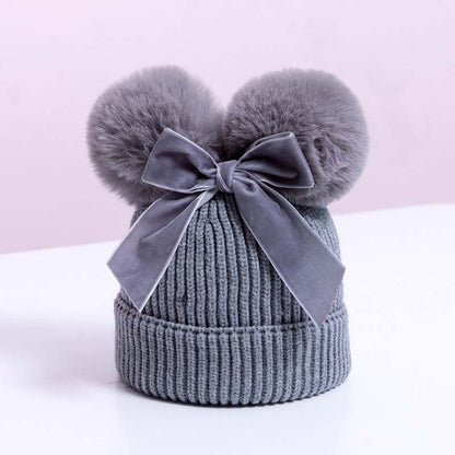 Skorter | Baby hat with double ball bow