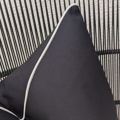 Skorter | Black outdoor cushion with cream piping - 43 x 43cm