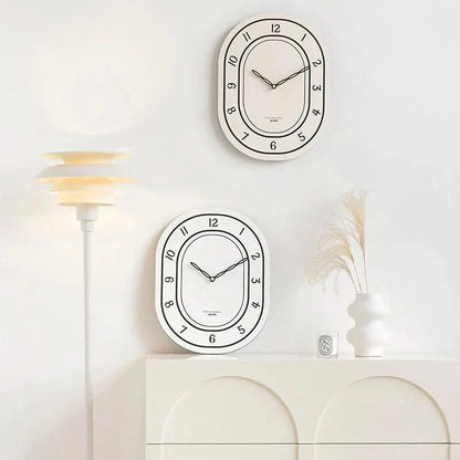 Skorter | Silent Oval Wall Clock with Roman Numerals Design