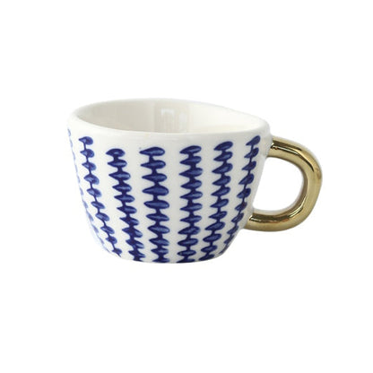 Skorter | Cup with abstract geometric pattern and gold handle