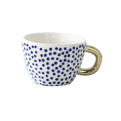 Skorter | Cup with abstract geometric pattern and gold handle