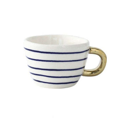 Skorter | Cup with abstract geometric pattern and gold handle