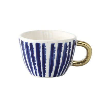 Skorter | Cup with abstract geometric pattern and gold handle