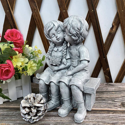 Skorter | Boy Kissing Girl Statue Sitting on Bench Figure