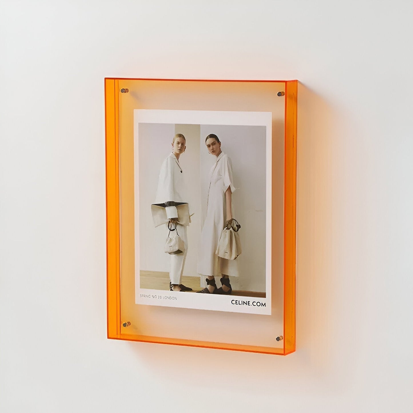 Skorter | Colored transparent acrylic frame for modern displays