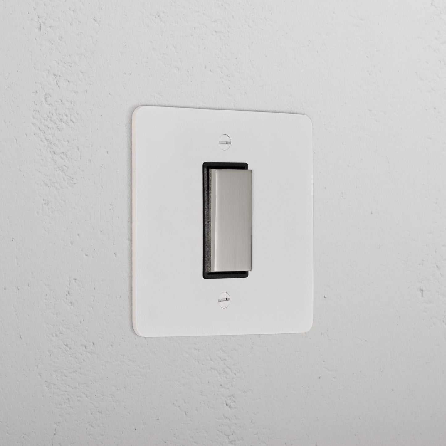 Skorter | 1G Central Reversible Rocker Switch - Paintable Polished Nickel Black
