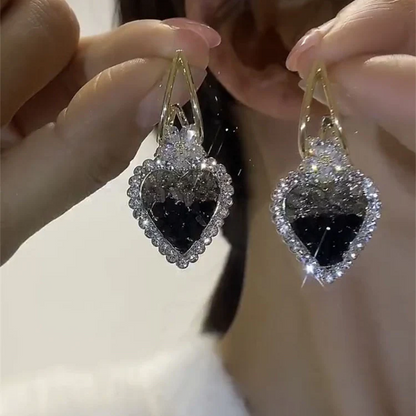 Skorter | Earrings with heart in green crystals