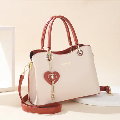 Skorter | Elegant women's handbag with sparkling heart pendant