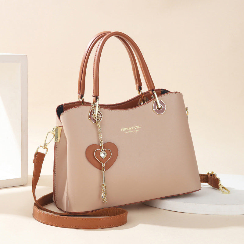 Skorter | Elegant women's handbag with sparkling heart pendant