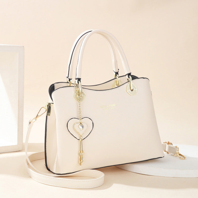 Skorter | Elegant women's handbag with sparkling heart pendant