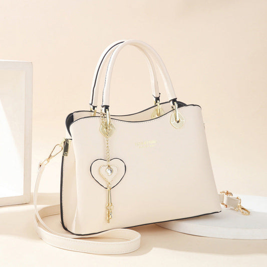 Skorter | Elegant women's handbag with sparkling heart pendant